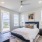 Apartments In Northwest Reno For Rent - The Retreat - Spacious Bedroom With Wood-Style Flooring, A Ceiling Fan, Windows With Blinds, And Access To Balcony