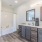 Luxury Three Bedroom Apartments in Reno NV - Vida - Modern Kitchen With Wood-Style Plank Flooring, Stainless Steel Appliances, Quartz Countertops, And Custom Cabinetry
