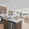 Apartments NW Reno - The Retreat - A spacious and well-lit kitchen with wood flooring and stainless steel appliances
