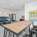 Large co-working space with large meeting tables and work stations