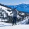 Skiers waiting on top of a mountain 